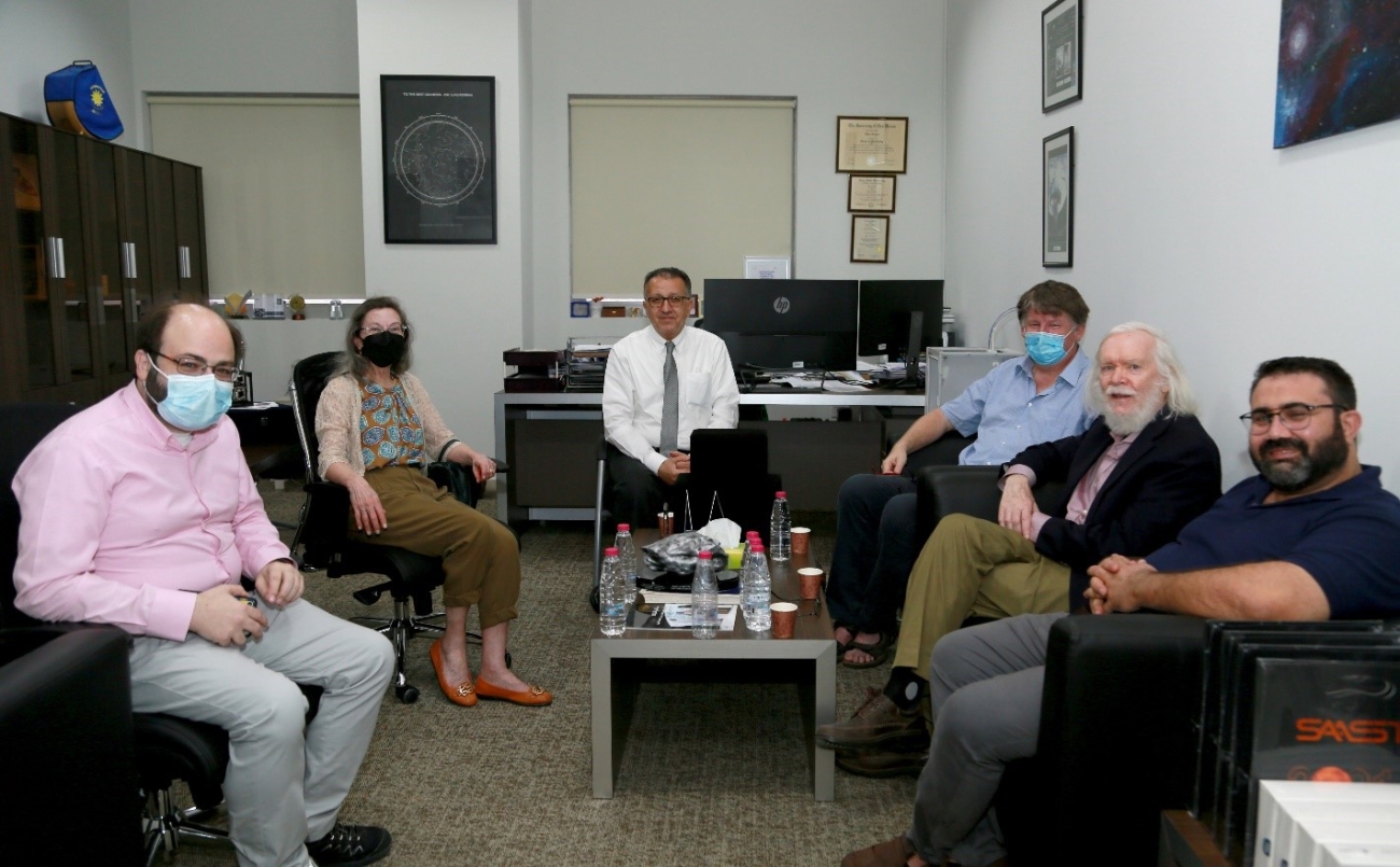 From left to right: Dr. Antonios Manousakis (UoS/SAASST), Prof. John Ellis&#039;s Wife, Prof. Ilias Fernini (UoS/SAASST), Prof. Roland Walter (Univ. of Geneva), Prof. John Ellis, and Prof. Amine Ahriche (UoS/DAPA). Photo Credit: Mr. Allaeddine Habachi (SAASST).